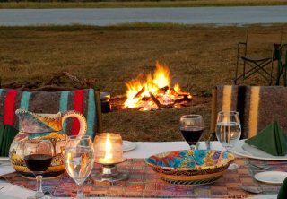 A lovely bush dinner setting at Imbabala Zambezi Safari Lodge in Victoria Falls, Zimbabwe