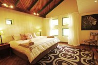 Guest room at Flat Dog Lodge - Victoria Falls accommodation Inside an en-suite double room at Flat Dog Lodge - Victoria Falls accommodation, Zimbabwe