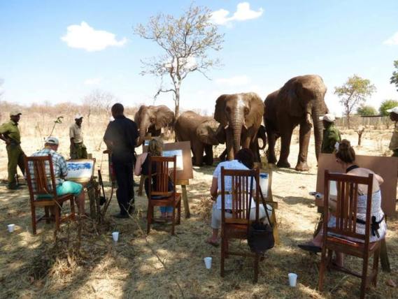 Painting with the elephants in Victoria Falls, Zimbabwe