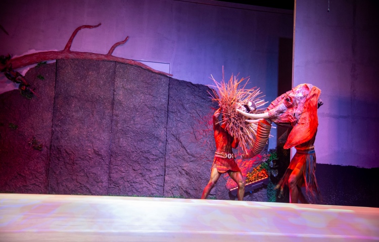 Ndlovu fights a lion - puppets on stage in Simunye theatre production - Victoria Falls, Zimbabwe