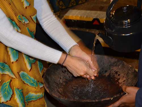 Hand washing is done before meals. The Boma, Victoria Falls, Zimbabwe