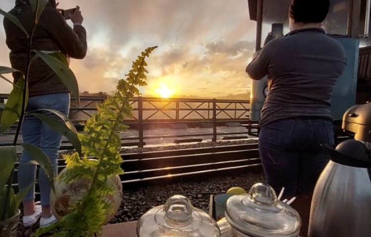 Sunrise Bridge Run with the tram with guests watching the sunrise on the Victoria Falls Bridge - tram trips from Victoria Falls, Zimbabwe