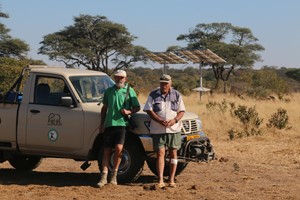 Dave & Gary, with the two solar arrays at Manga 1 pan