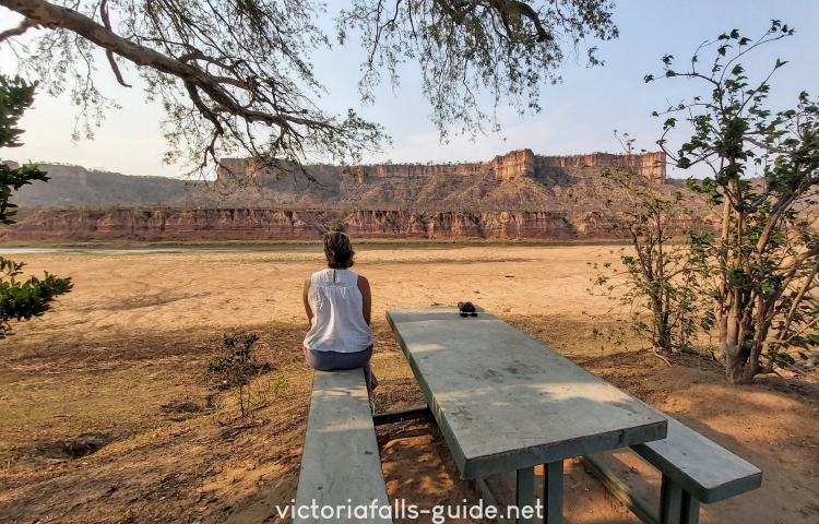 Sitting in front of the Runde River and the Chilijo cliffs - Victoria Falls Guide