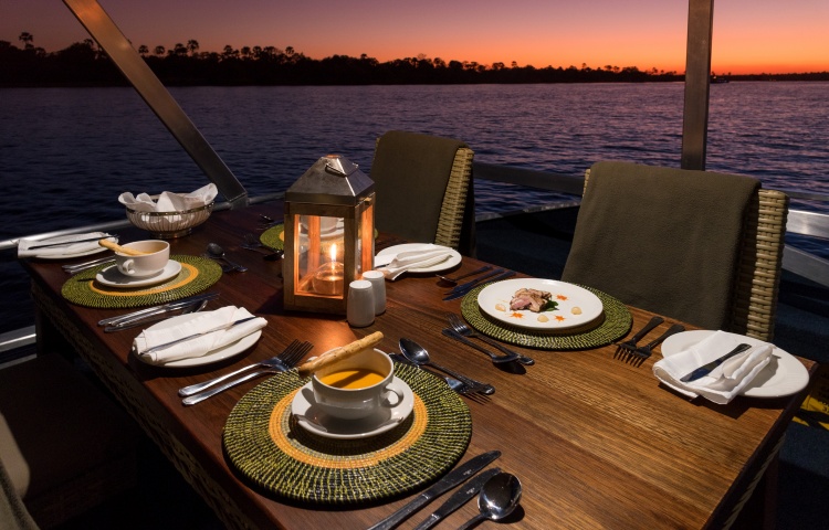 Dinner is set on the Malachite dinner cruise on the Zambezi River - Victoria Falls, Zimbabwe