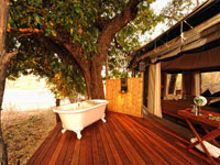Deck and outdoor bath at Kanga Camp in Mana Pool, Zimbabwe