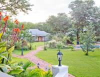 Lush garden at Pioneers Lodge in Victoria Falls, Zimbabwe