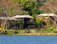 The guest tents along the lake shore at Romelda Retreat, Zimbabwe