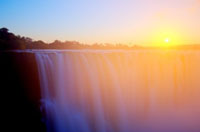 Magestic Victoria Falls at sunrise, seen from the Zimbabwe side