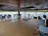Large under cover aft deck with 2 tables and chairs, Bar, Large fridge/Bottle cooler.