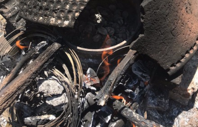 Making jewellery over a forge from snare wire