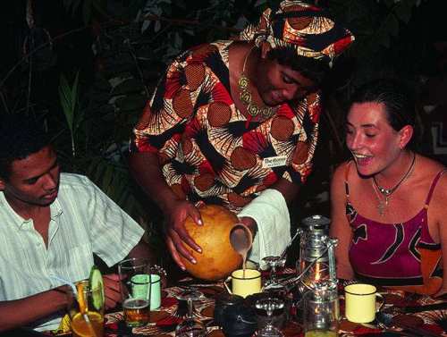 Tasting of the local brew 'mahewu' at The Boma, Victoria Falls, Zimbabwe