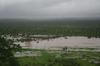 Sinamatella River in flood below camp. (Stephen & Sue Long)