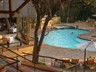 The swimming pool and dining area on the left