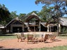 The fire pit and view of the deck and main lodge