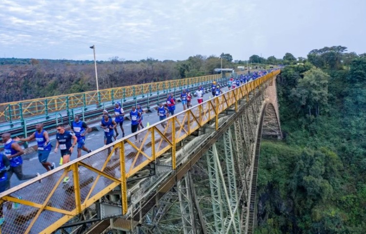 Victoria Falls Marathon runners crossing the Victoria Falls Bridge between Zimbabwe and Zambia