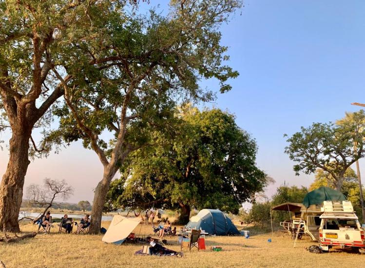 Campers by the Zambezi River in the Zambezi National Park making use of hired vehicle and camping equipment by Victoria Falls 4x4 Hire - for self-driving in Zimbabwe