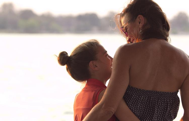 Family adventure on a sunset cruise on the Zambezi River above the Victoria Falls, Zimbabwe