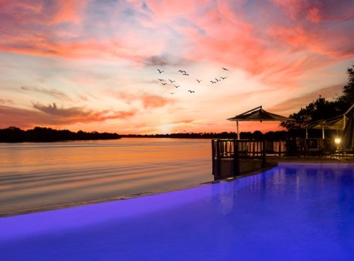 David Livingstone Safari lodge and Spa, sunset, pool, Zambezi River, Livingstone, Zambia