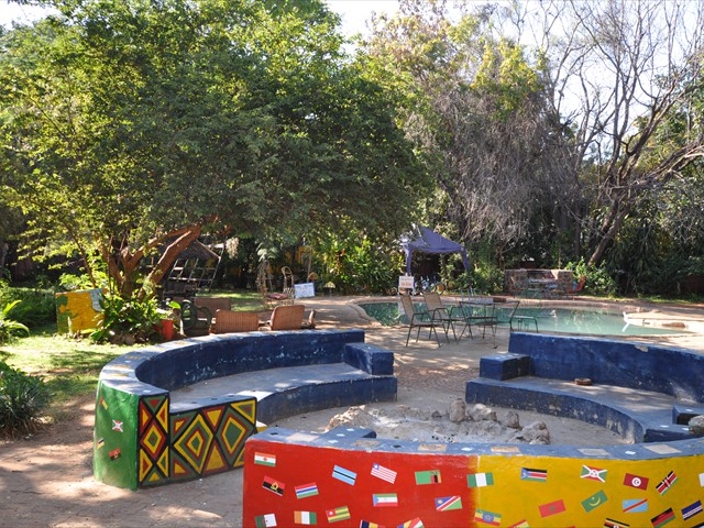 The fire pit and swimming pool in the background