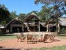 The fire pit and view of the deck and main lodge
