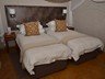Three-quarter beds in a Safari Suite bedroom