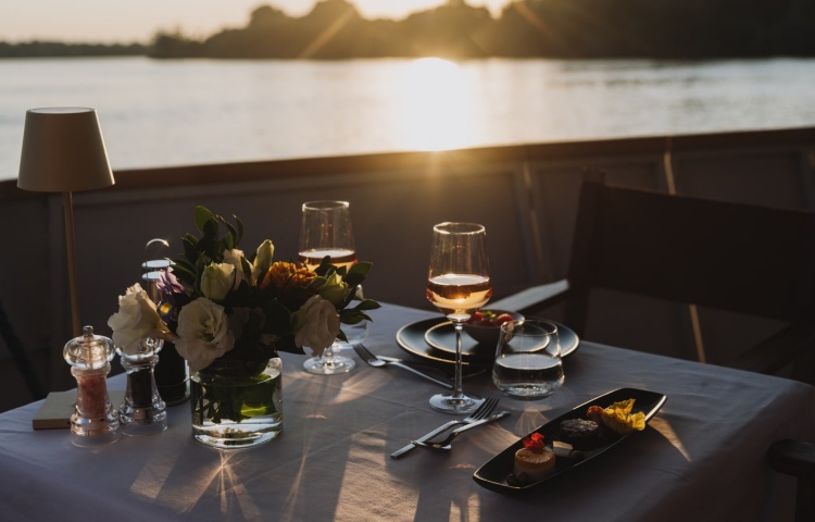Drinks along the Zambezi River on a Sunset Dinner cruise in Victoria Falls, Zimbabwe